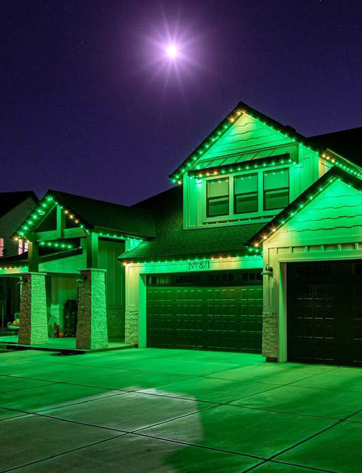 Exterior of SWFL home showcasing Trimlights illuminating front of property